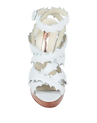 https://images.styletyx.com/images/white-leather-sandals-rupert-sanderson-424174_4.webp
