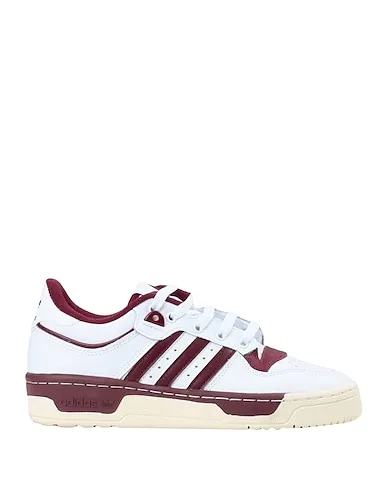https://images.styletyx.com/images/white-leather-sneakers-rivalry-low-86-w-shoes-adidas-13139501_1.webp