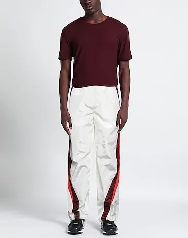 https://images.styletyx.com/images/white-techno-fabric-casual-pants-marine-serre-67775594_2.webp