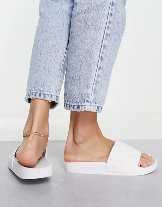 https://images.styletyx.com/images/wide-fit-flare-quilted-sliders-in-white-asos-design-1739365_4.webp