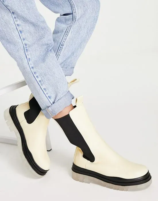 https://images.styletyx.com/images/winter-translucent-sole-boots-in-cream-public-desire-wide-fit-2788860_4.webp