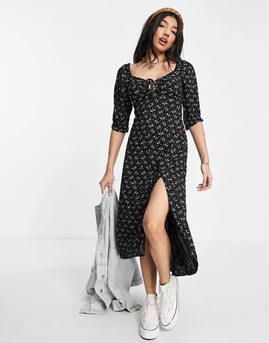 https://images.styletyx.com/images/woven-midi-dress-in-black-floral-hollister-1829643_1.webp