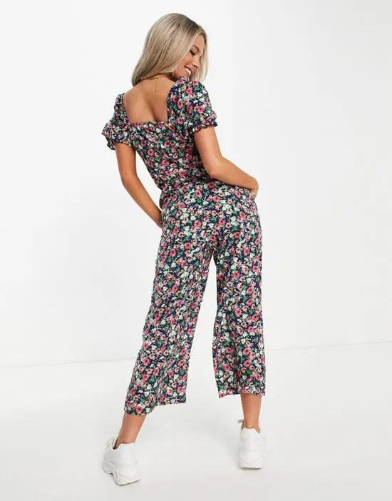 https://images.styletyx.com/images/wrap-front-jumpsuit-in-navy-floral-ax-paris-2862574_2.webp