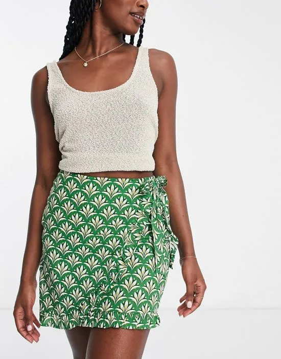 https://images.styletyx.com/images/wrap-front-tie-side-mini-skirt-in-green-urban-threads-2483759_1.webp