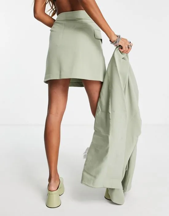 https://images.styletyx.com/images/wrap-mini-skirt-in-green-part-of-a-set-only-1903163_2.webp