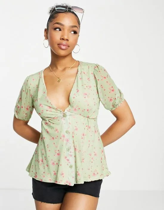 https://images.styletyx.com/images/x-perrie-sian-puff-sleeve-button-front-blouse-in-lime-floral-print-in-the-style-1883493_1.webp