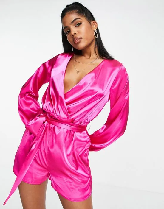 https://images.styletyx.com/images/x-perrie-sian-wrap-front-belted-romper-in-pink-in-the-style-1754153_1.webp