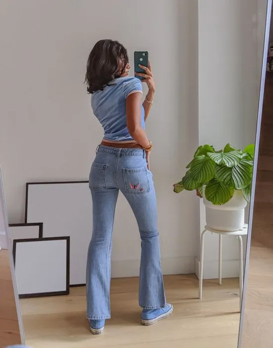 https://images.styletyx.com/images/x-pose-and-repeat-mid-rise-90s-flared-jeans-with-butterfly-appliques-in-blue-labelrail-13286485_3.webp