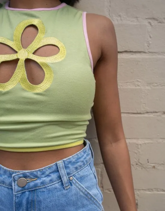 https://images.styletyx.com/images/x-pose-and-repeat-sleeveless-top-with-ribbon-bound-flower-cut-outs-labelrail-1850490_2.webp