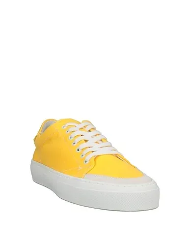 https://images.styletyx.com/images/yellow-canvas-sneakers-john-elliott-3064621_2.webp