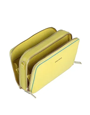 https://images.styletyx.com/images/yellow-cross-body-bags-piquadro-2956116_2.webp