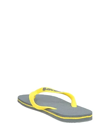 https://images.styletyx.com/images/yellow-flip-flops-philipp-plein-1006213320_3.webp