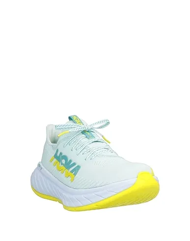 https://images.styletyx.com/images/yellow-knitted-sneakers-hoka-one-one-13139735_2.webp