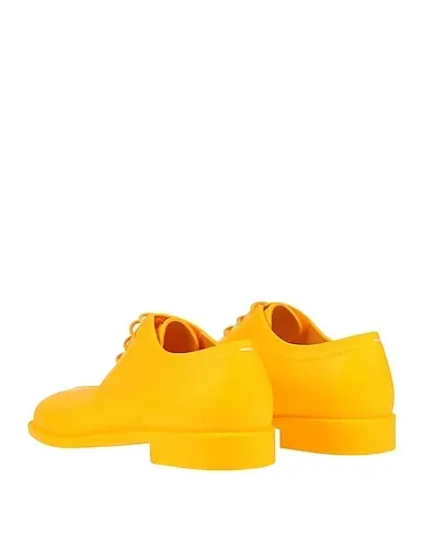https://images.styletyx.com/images/yellow-laced-shoes-maison-margiela-3131705_3.webp