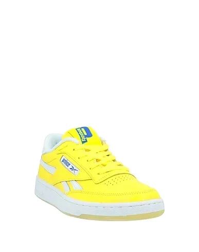 https://images.styletyx.com/images/yellow-leather-sneakers-reebok-2509590_2.webp