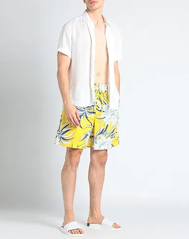 https://images.styletyx.com/images/yellow-plain-weave-swim-shorts-valentino-2844792_2.webp