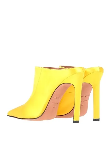 https://images.styletyx.com/images/yellow-satin-mules-and-clogs-altuzarra-206372959_3.webp
