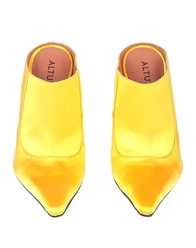 https://images.styletyx.com/images/yellow-satin-mules-and-clogs-altuzarra-206372959_4.webp