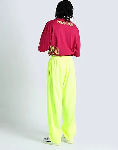 https://images.styletyx.com/images/yellow-techno-fabric-casual-pants-balenciaga-1591033_3.webp