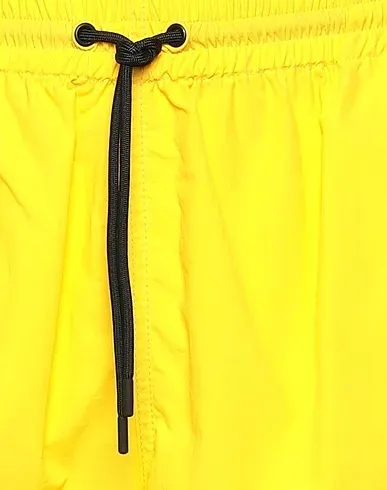 https://images.styletyx.com/images/yellow-techno-fabric-casual-pants-msgm-3359176_4.webp