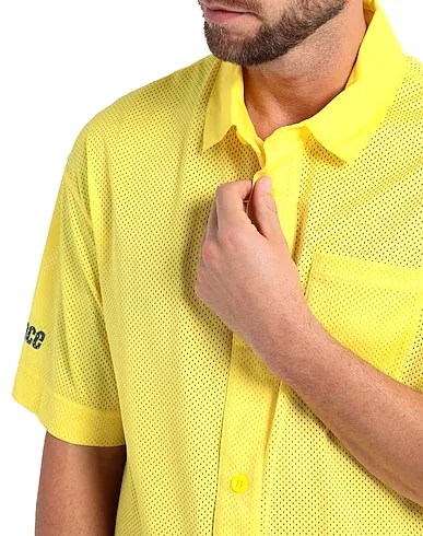 https://images.styletyx.com/images/yellow-techno-fabric-rxp-polo-shirt-reebok-1225884374_4.webp