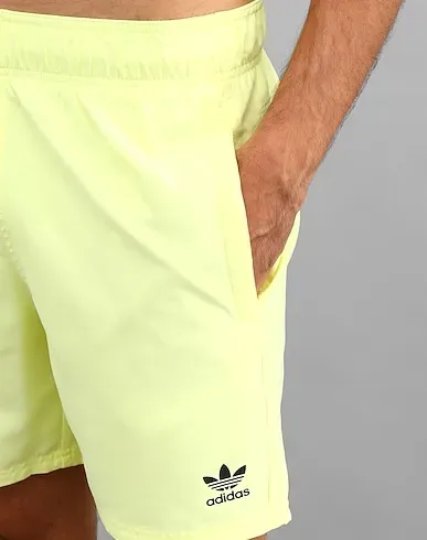 https://images.styletyx.com/images/yellow-techno-fabric-swim-shorts-essentials-ss-adidas-1129891_5.webp