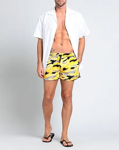 https://images.styletyx.com/images/yellow-techno-fabric-swim-shorts-gcds-3145396_2.webp