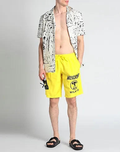 https://images.styletyx.com/images/yellow-techno-fabric-swim-shorts-love-moschino-1004002427_2.webp