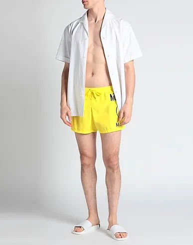 https://images.styletyx.com/images/yellow-techno-fabric-swim-shorts-love-moschino-1010899153_2.webp