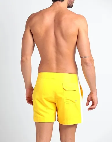 https://images.styletyx.com/images/yellow-techno-fabric-swim-shorts-palm-angels-2963660_3.webp