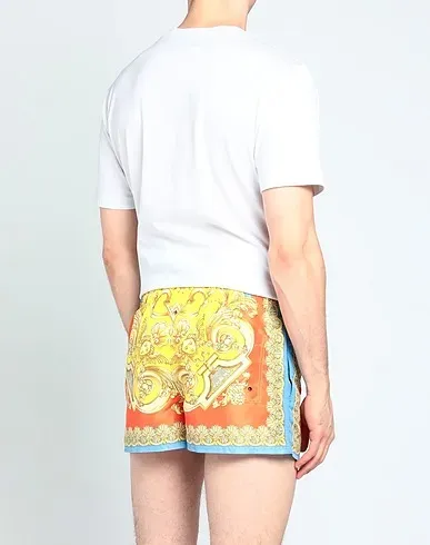 https://images.styletyx.com/images/yellow-techno-fabric-swim-shorts-versace-13298511_3.webp