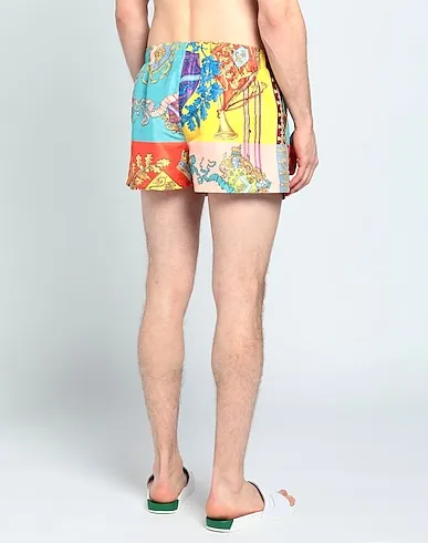 https://images.styletyx.com/images/yellow-techno-fabric-swim-shorts-versace-13298772_3.webp