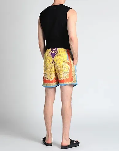 https://images.styletyx.com/images/yellow-techno-fabric-swim-shorts-versace-13304998_3.webp
